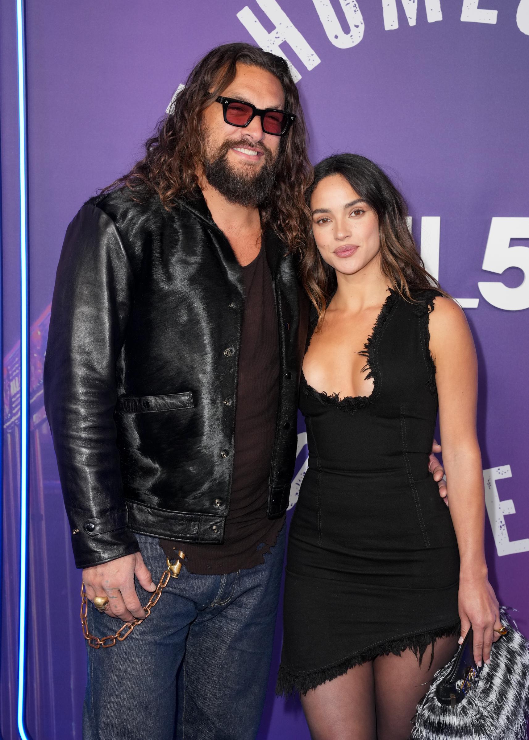 Jason Momoa and Adria Arjona are seen at "SNL50: The Homecoming Concert" at Radio City Music Hall on February 14, 2025, in New York | Source: Getty Images