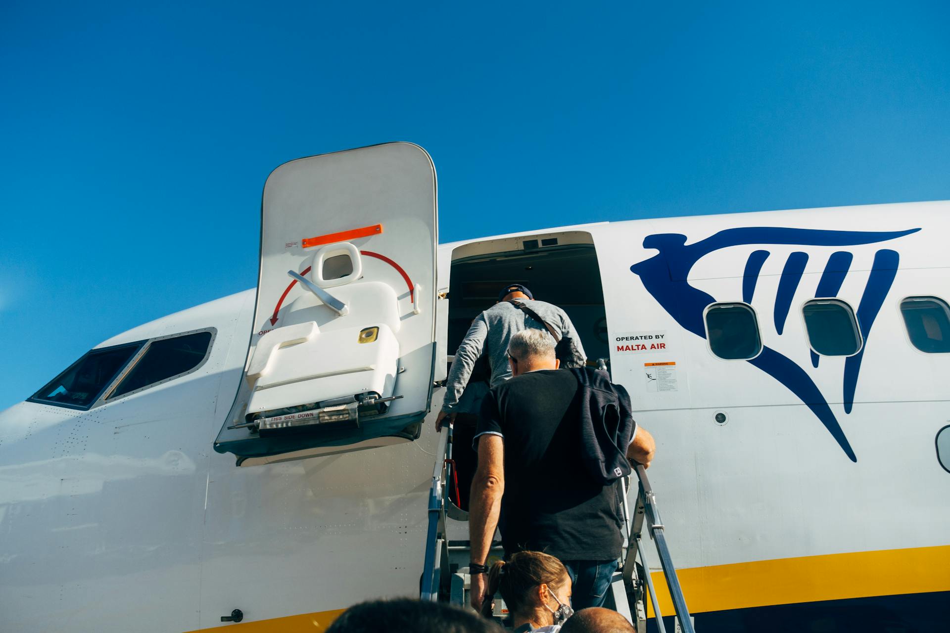 People boarding an airplane | Source: Pexels