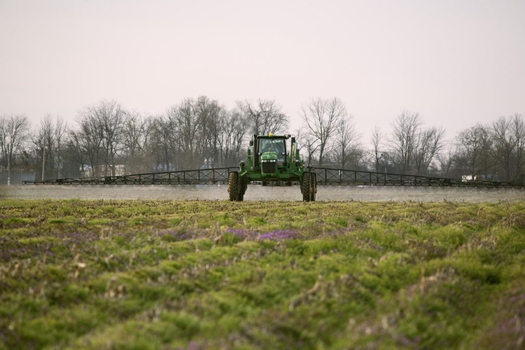 A sprayer applies herbicide in late winter to a field for no-till cotton planting in Arkansas on July 7, 2023 | Source: Getty Images