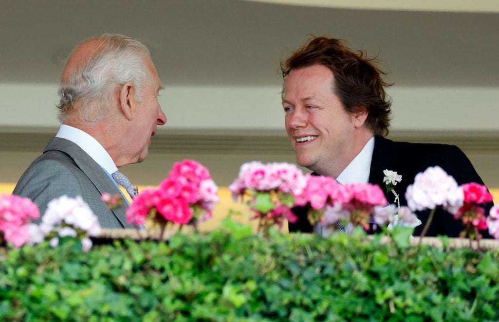 King Charles and Tom Parker Bowles shared a lighthearted moment on day three of Royal Ascot on June 20, 2024, in England. The father and stepson displayed their close bond during the iconic event. | Source: Getty Images