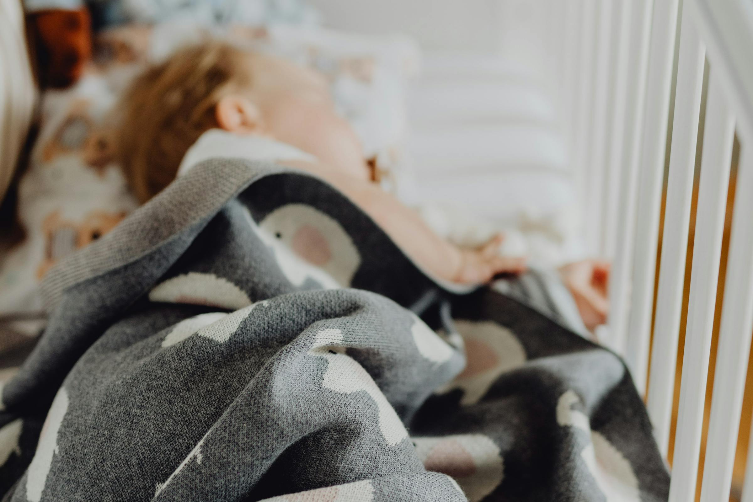 Baby sleeping in a crib | Source: Pexels