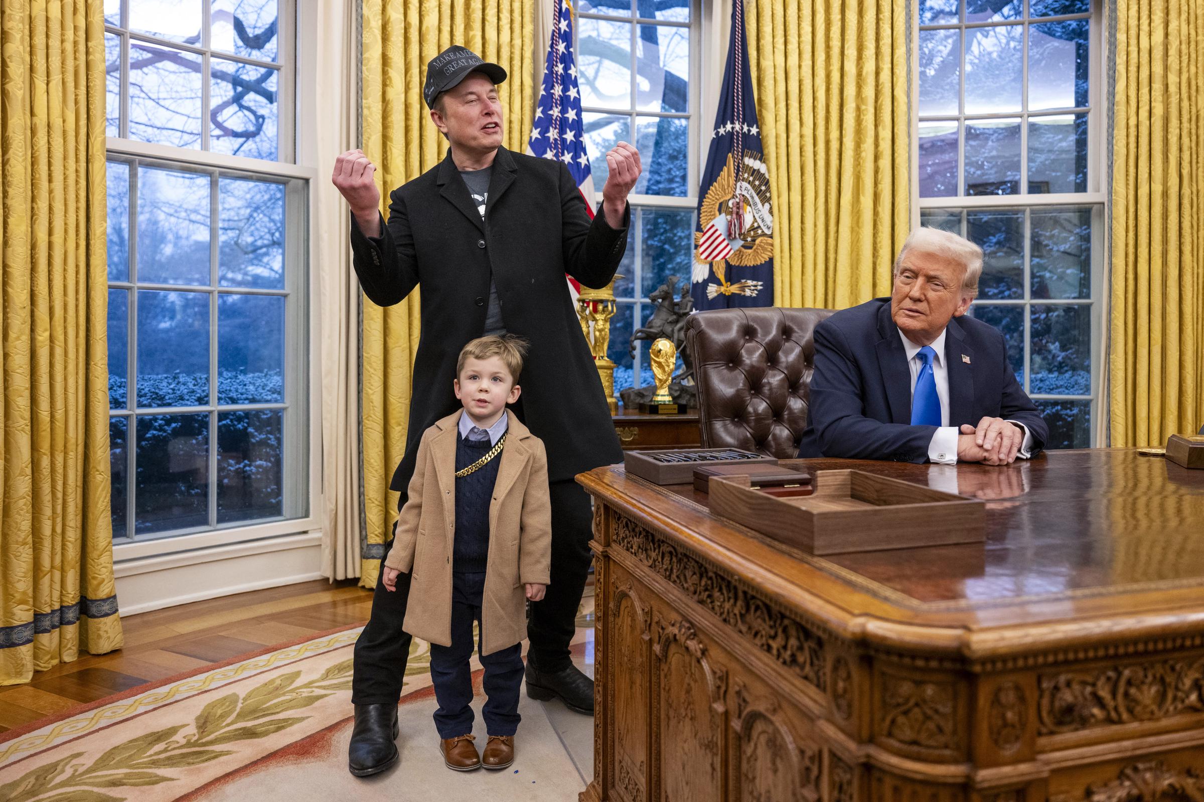 Elon Musk and X Æ A-Xii join Donald Trump as he signs executive orders in the Oval Office of the White House. | Source: Getty Images