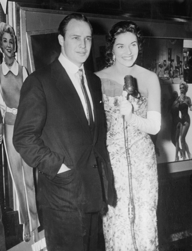 Actor Marlon Brando and the former Miss America of 1955 photographed at the Capital Theater in 1955. | Source: Getty Images