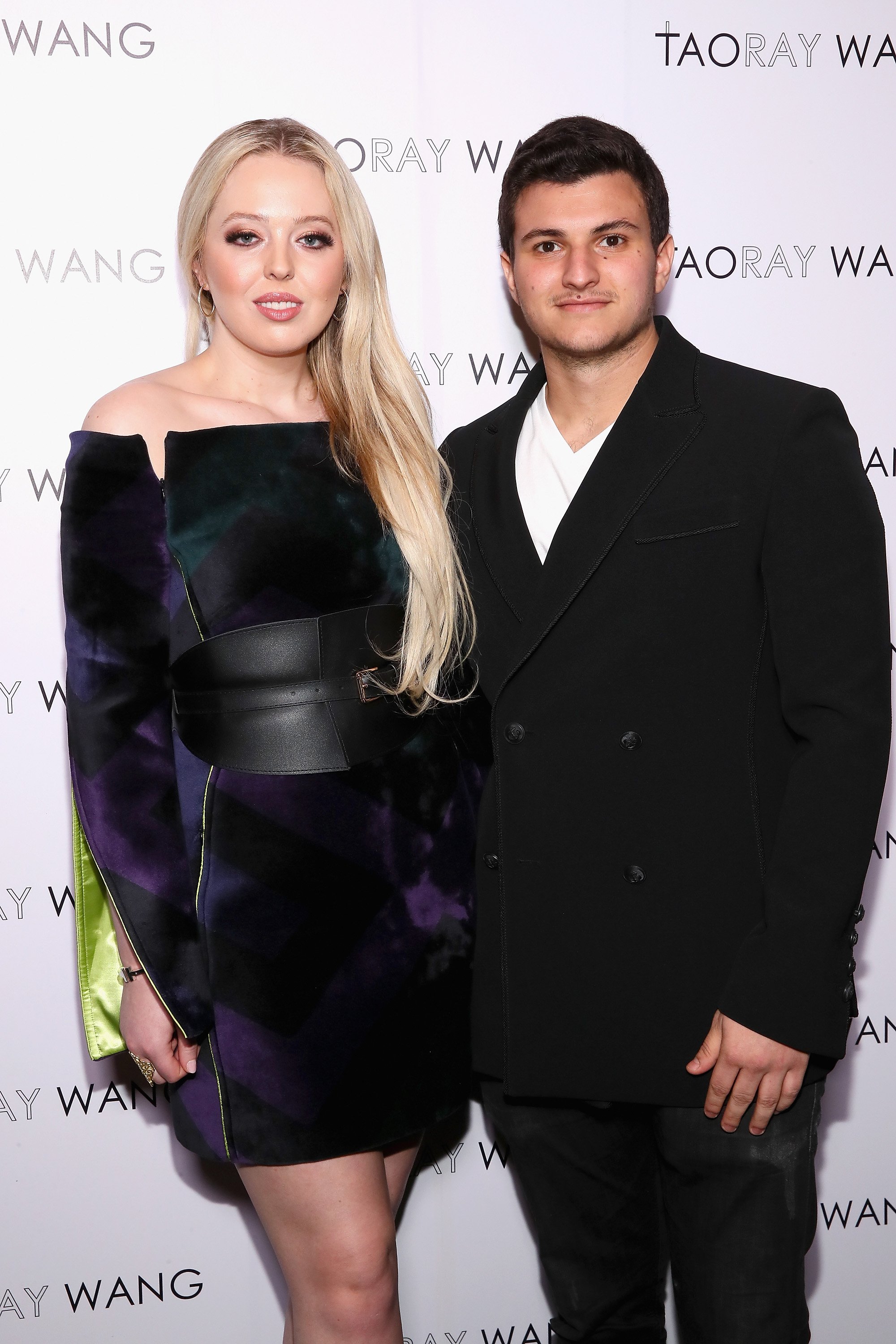 Internet personality Tiffany Trump and businessman Michael Boulos pose backstage for the Taoray Wang fashion show during New York Fashion Week: The Shows at Gallery II at Spring Studios on February 9, 2019 in New York City ┃Source: Getty Images