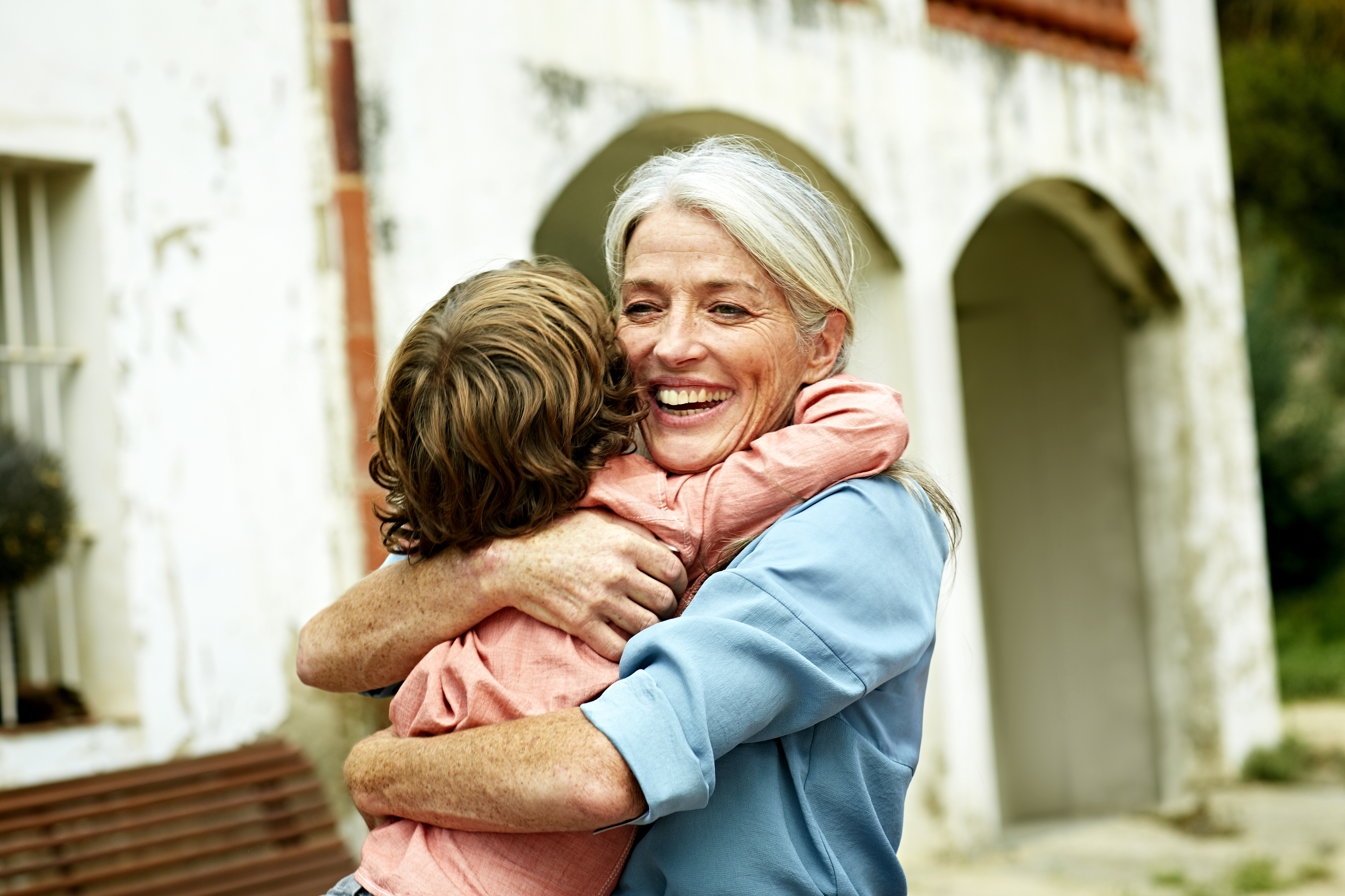 A grandmother greeting her grandson | Source: Getty Images