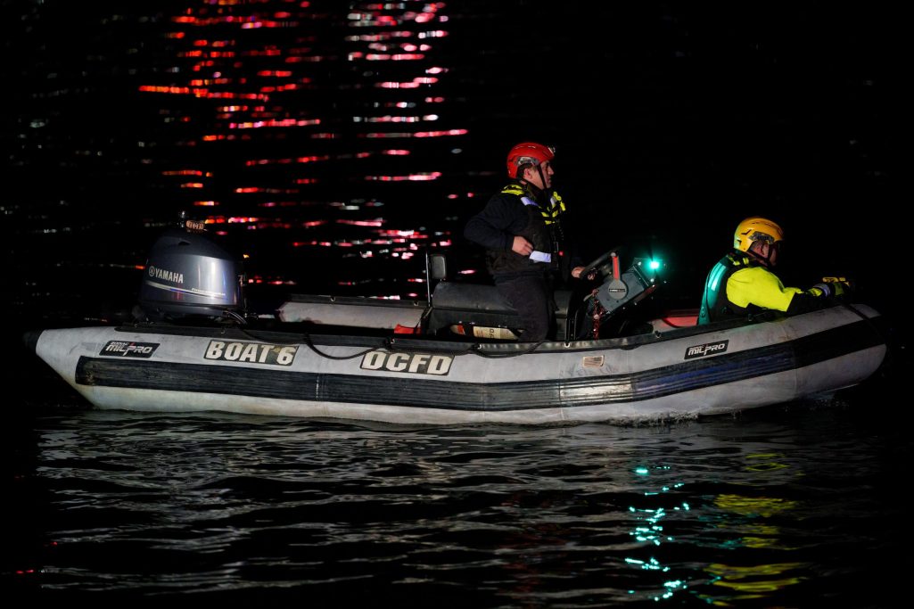 An emergency response team make their way to airplane wreckage in the Potomac River on January 30, 2025, in Arlington, Virginia. | Source: Getty Images