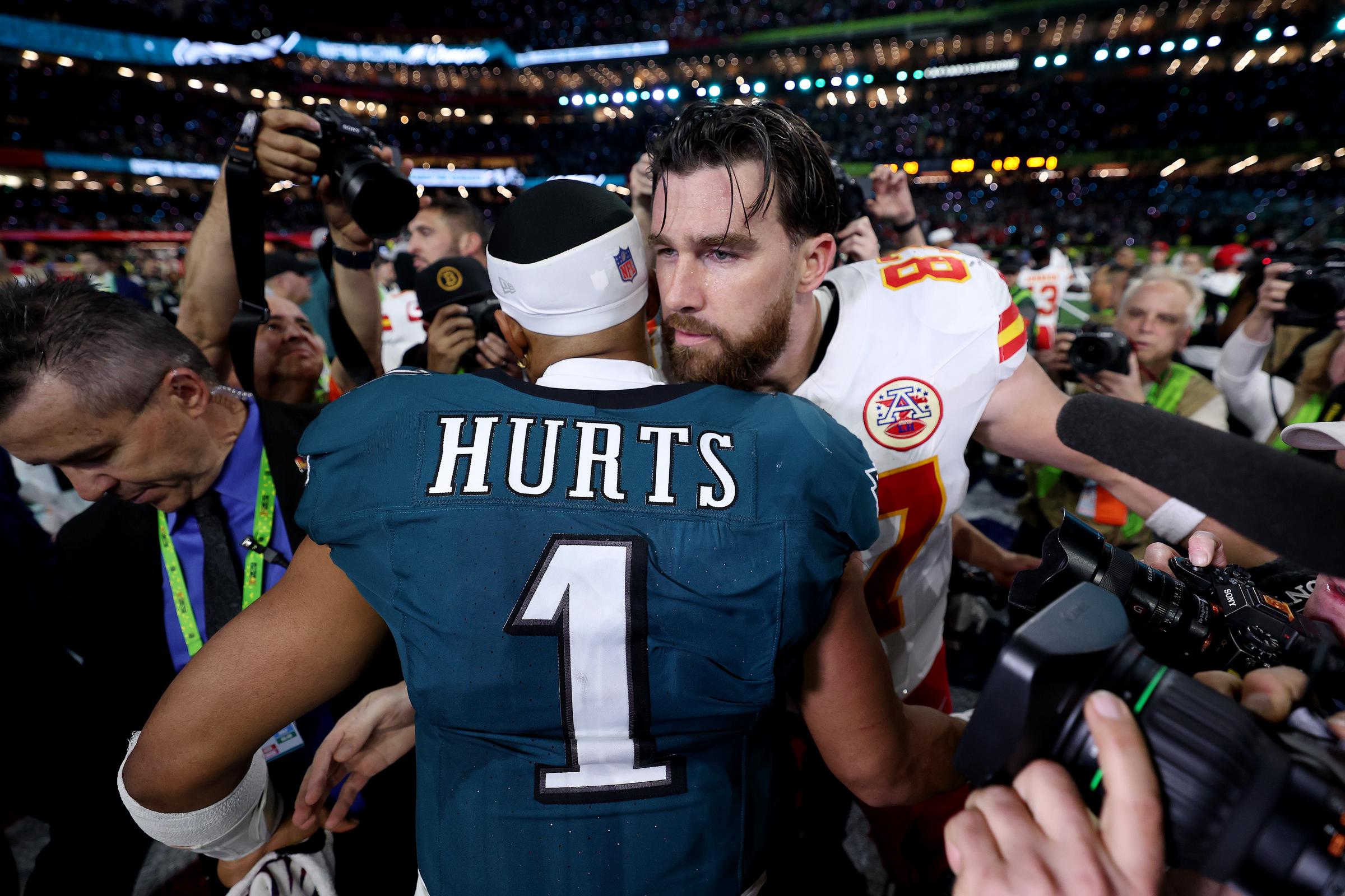 Jalen Hurts of the Philadelphia Eagles and Travis Kelce of the Kansas City Chiefs meet postgame at Caesars Superdome on February 9, 2025 | Source: Getty Images