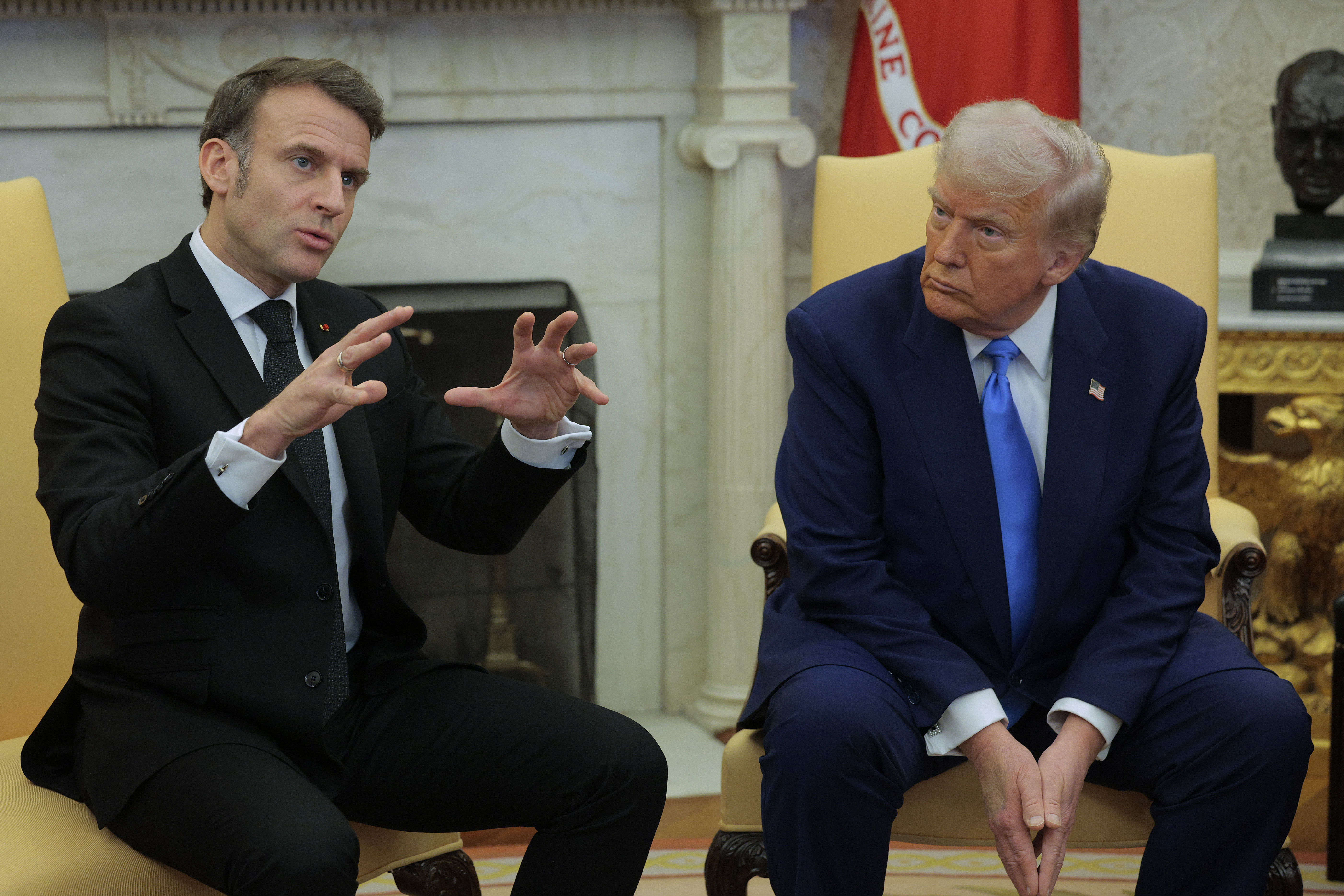 Emmanuel Macron speaking during his meeting with Donald Trump as Trump looks on. | Source: Getty Images