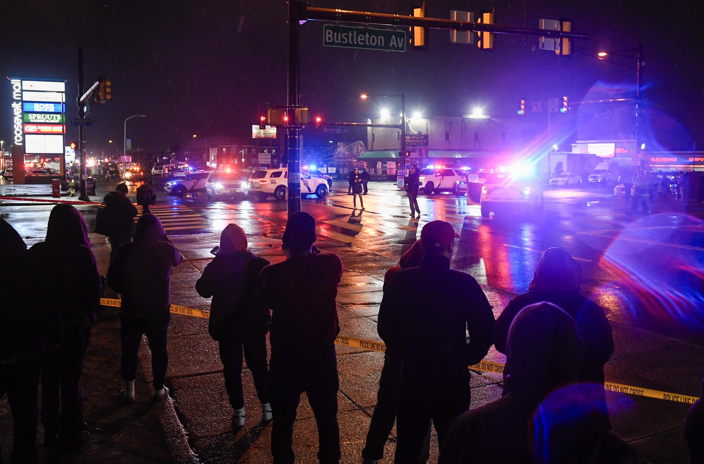 People gather as emergency service members respond to a plane crash in a neighborhood near Cottman Avenue in Philadelphia, Pennsylvania, on January 31, 2025 | Source: Getty Images