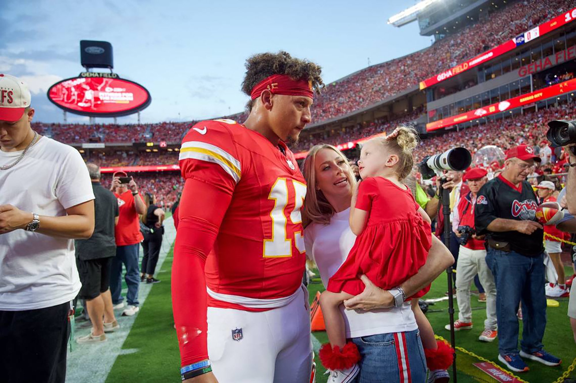 Patrick Mahomes visits his wife Brittany and daughter Sterling on the sideline on Sept. 5, 2024, at GEHA Field at Arrowhead Stadium in Kansas City, Missouri. | Source: Getty Images