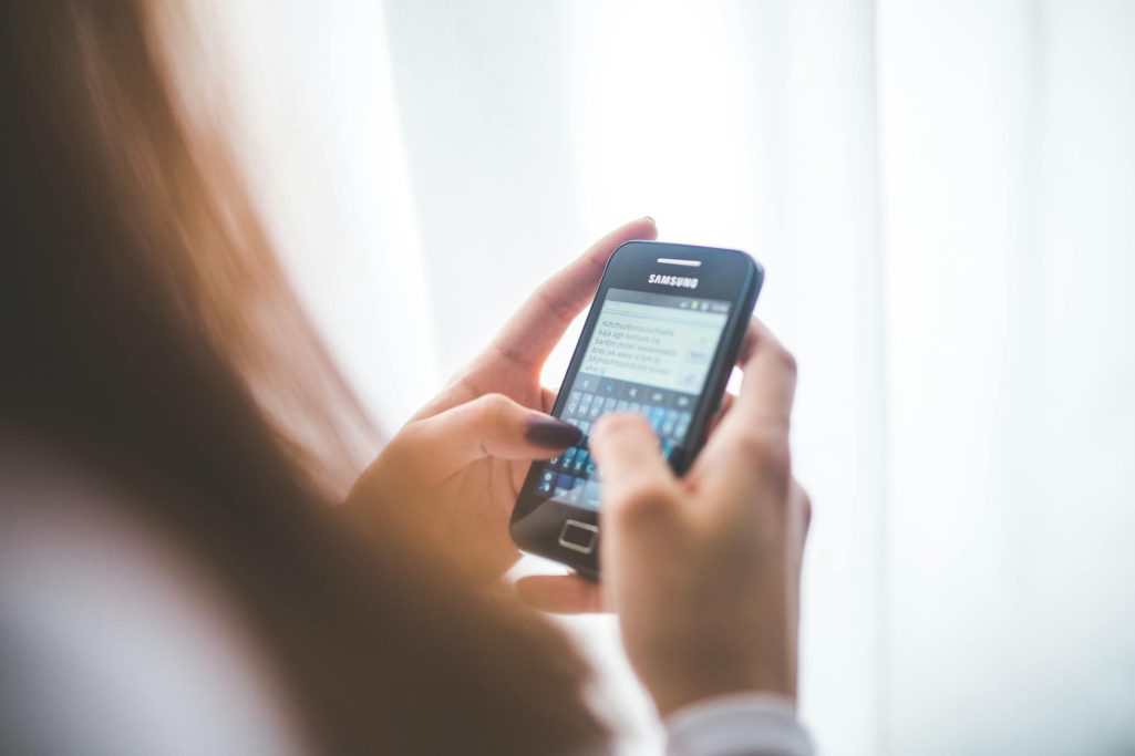 A woman looking at her phone | Source: Pexels